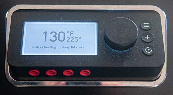 LCD display with a dial on the right and red inputs underneath