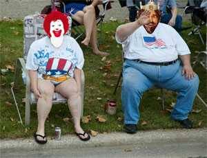 ronald mcdonald and burger king sitting in lawn chairs
