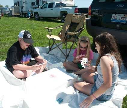 Barbecue competitors pass time playing cards Barbecue competitors pass time playing cards
