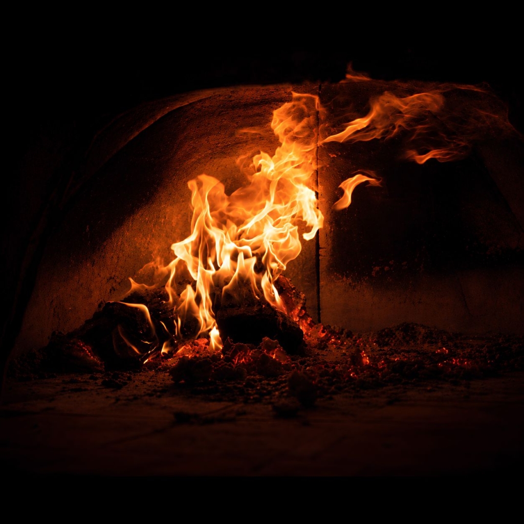 Logs burning against a dark background.