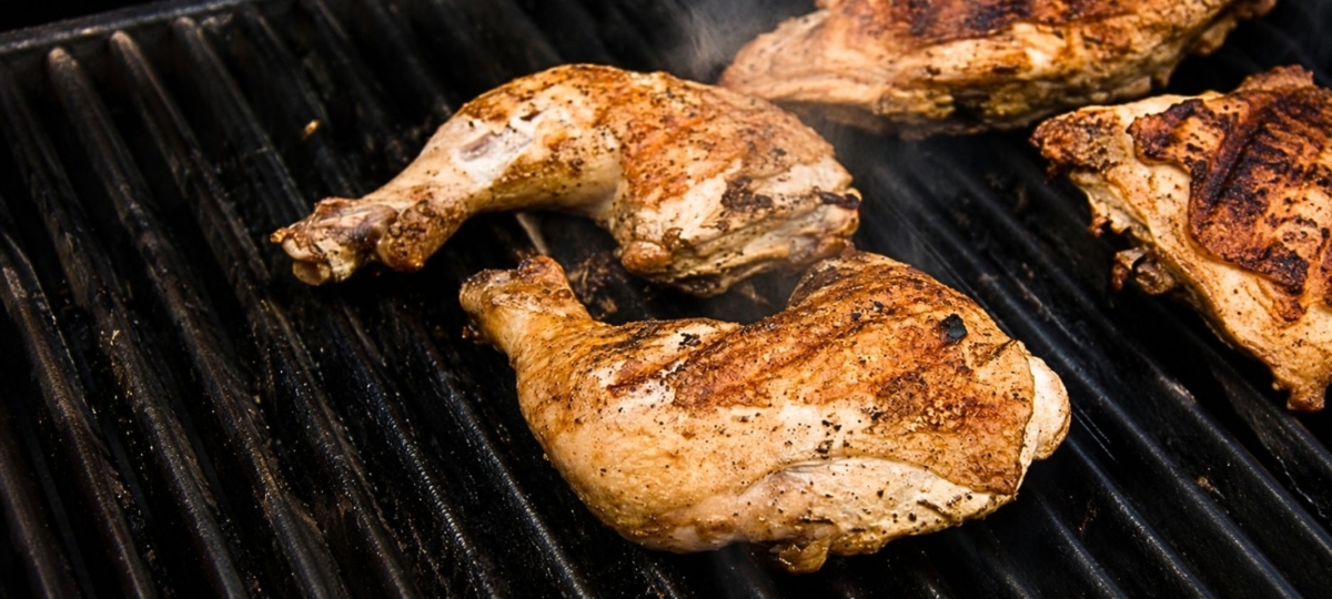 Grilled Cornell chicken on a gas grill
