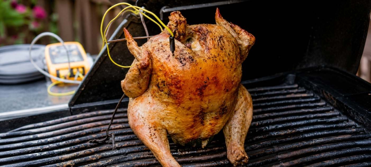 Beer can chicken on a grill