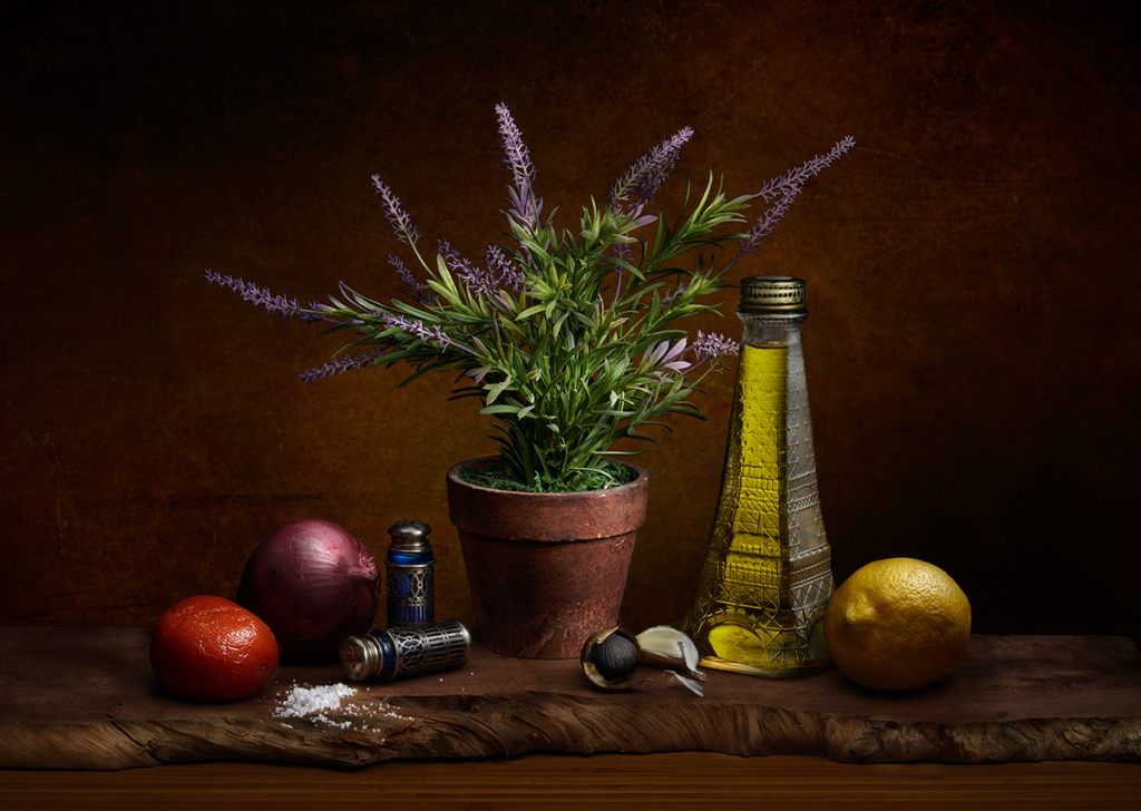 marinade ingredients include olive oil, lemon, onion and herbs on a table.