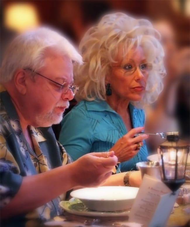 two people eating soup
