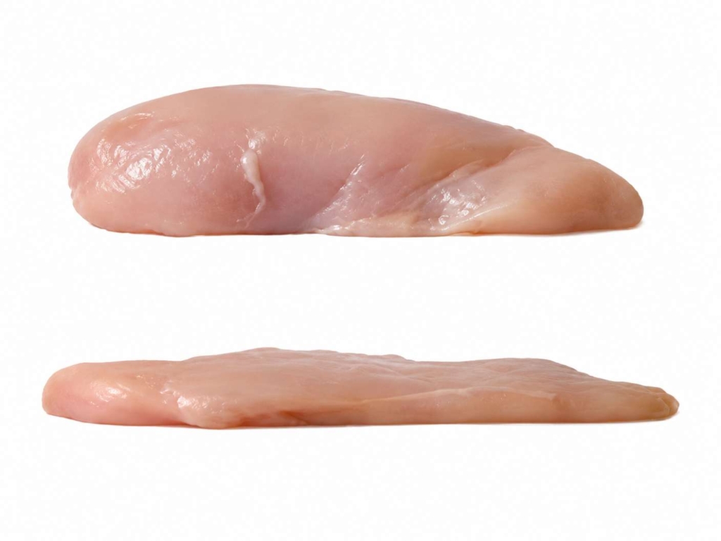 Whole chicken breast with a chicken breast that has been pounded flat