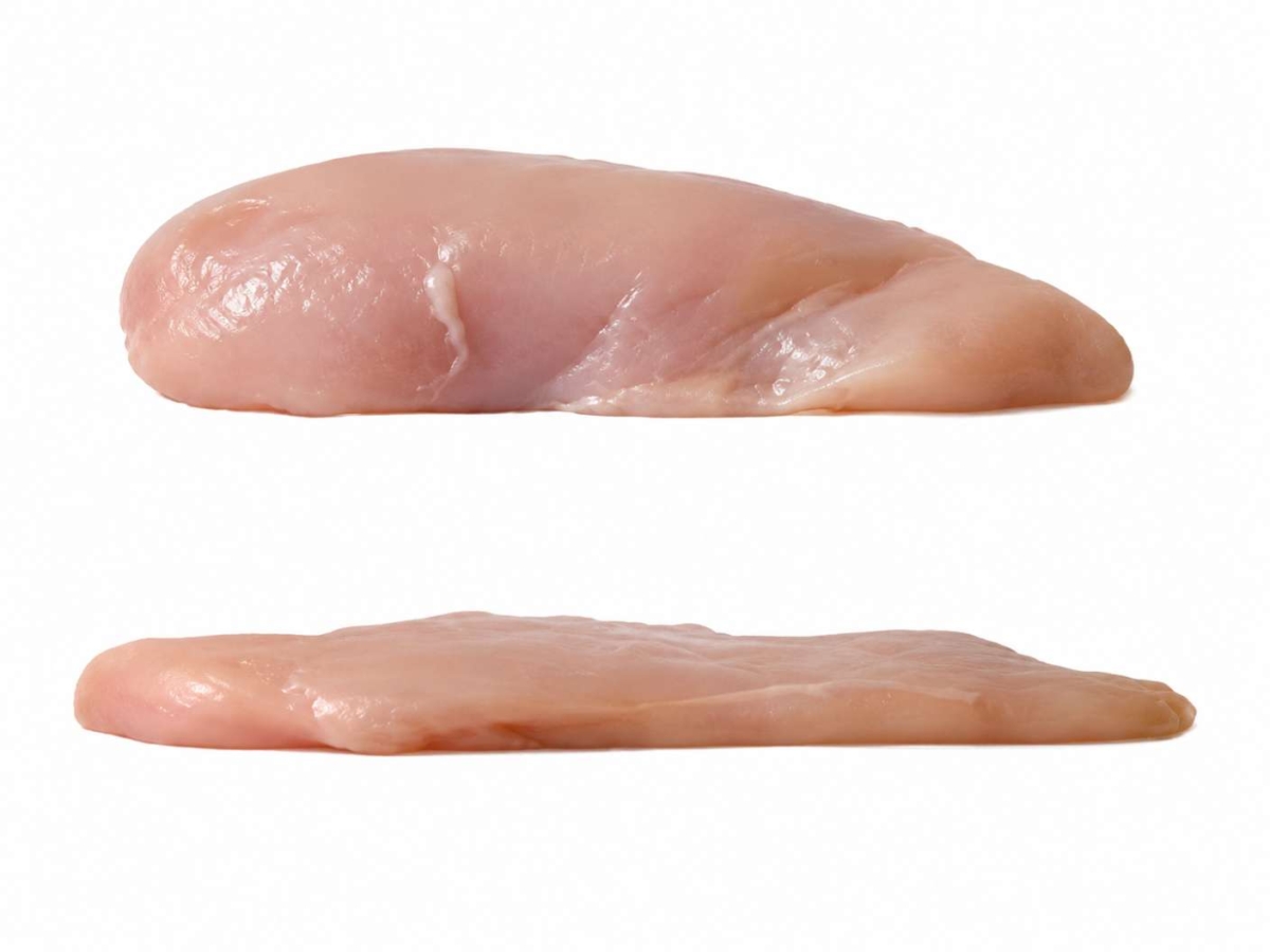 Whole chicken breast with a chicken breast that has been pounded flat