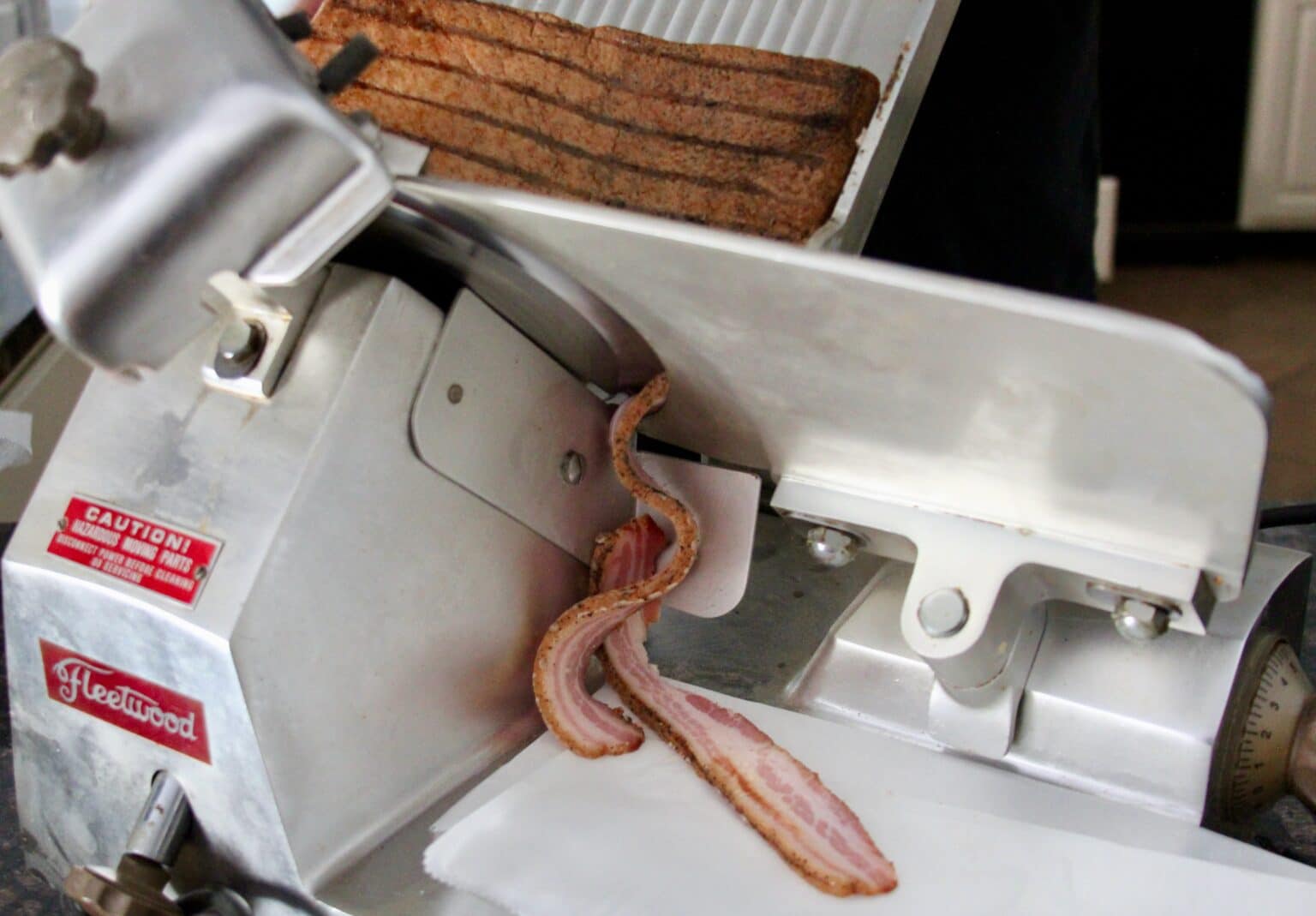 slicing homemade bacon