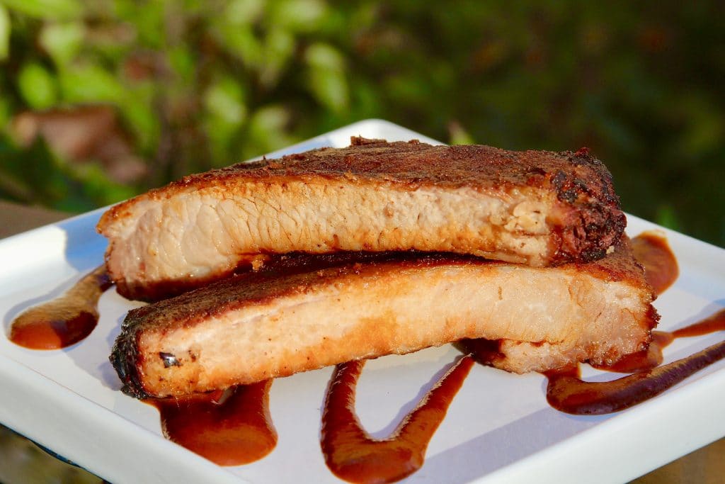 Sous vide and smoked ribs sliced and plated