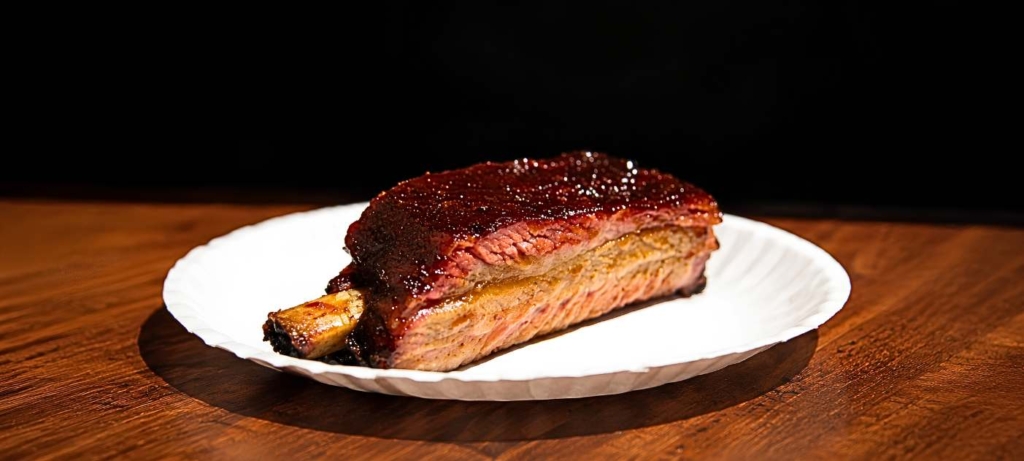 Competition pork rib on a white plate