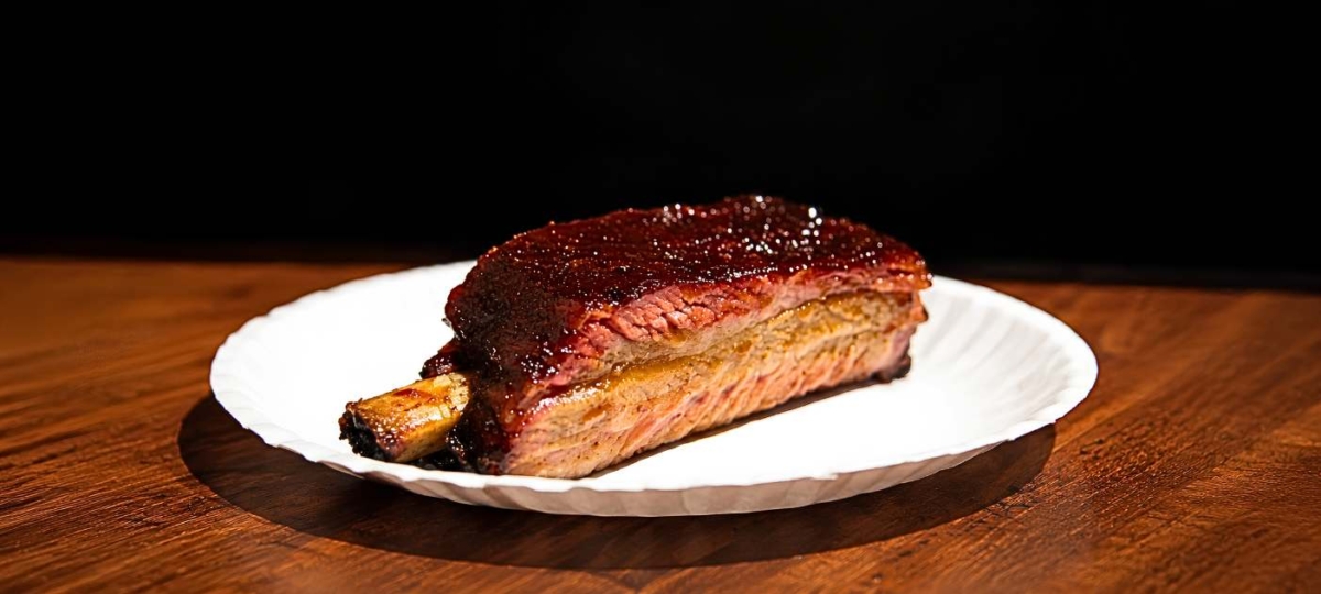 Competition pork rib on a white plate