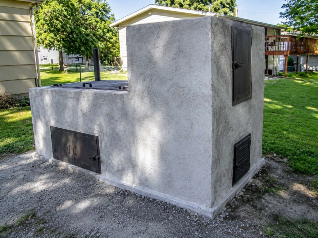 Homemade cinder block and concrete whole hog pit