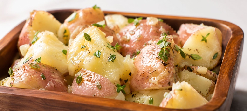 French potato salad in a wooden bowl.