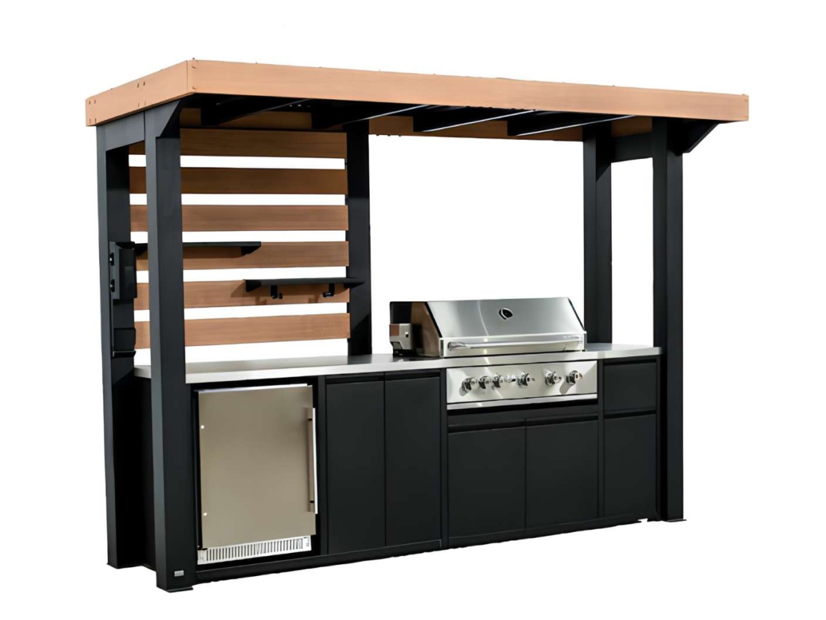 Outdoor kitchen with grill and fridge.