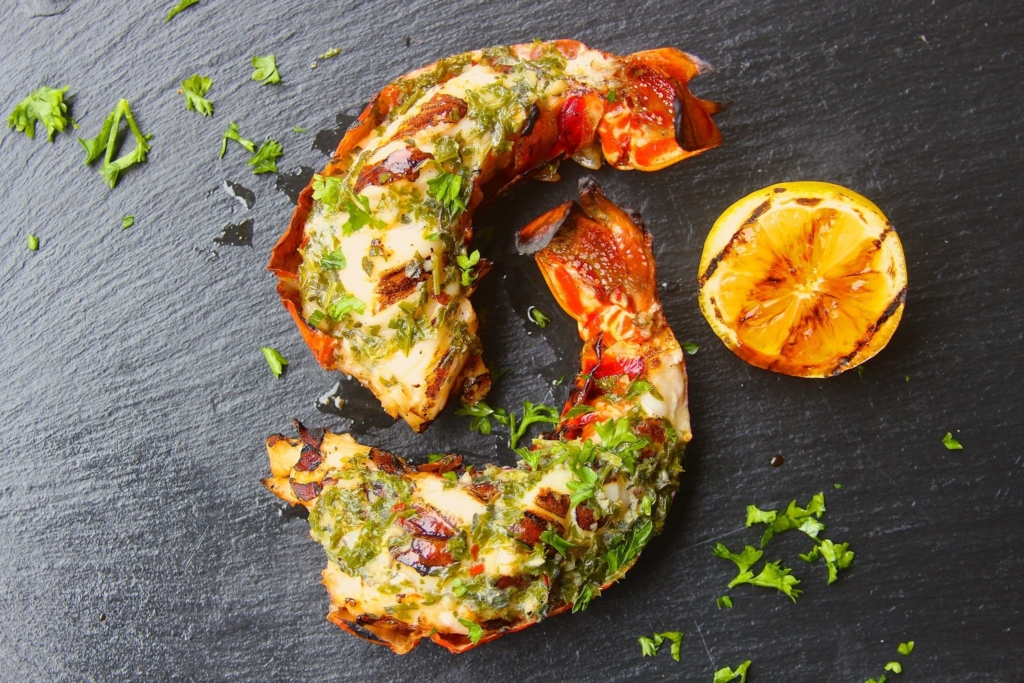 Grilled split lobster tail plated
