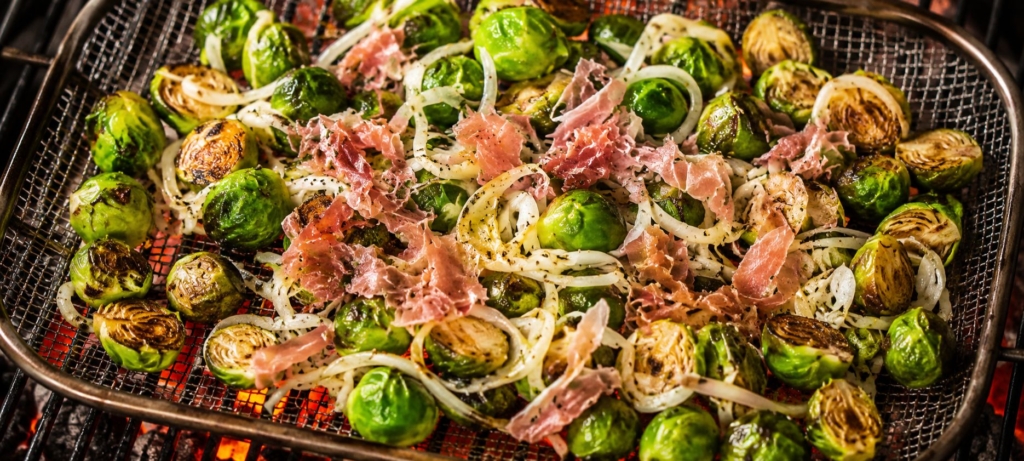 brussels sprouts with shaved fennel and Prosciutto on a grill