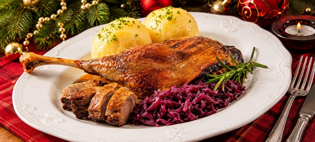 Roast goose plated alongside red cabbage and potatoes.