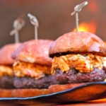 Three pimento cheese hamburgers on a plate