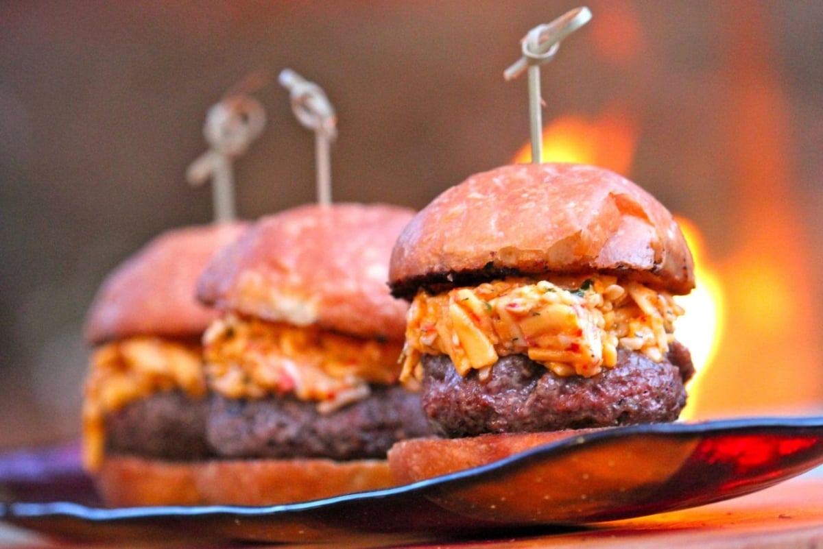 Three pimento cheese hamburgers on a plate