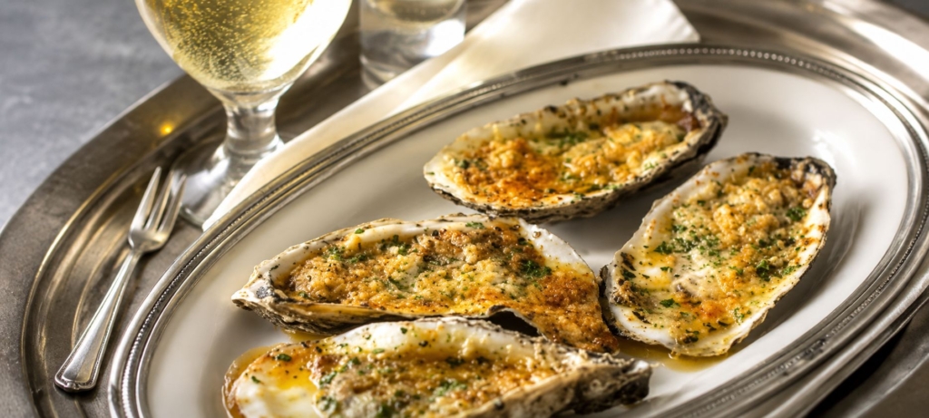 Grilled oysters on a plate.