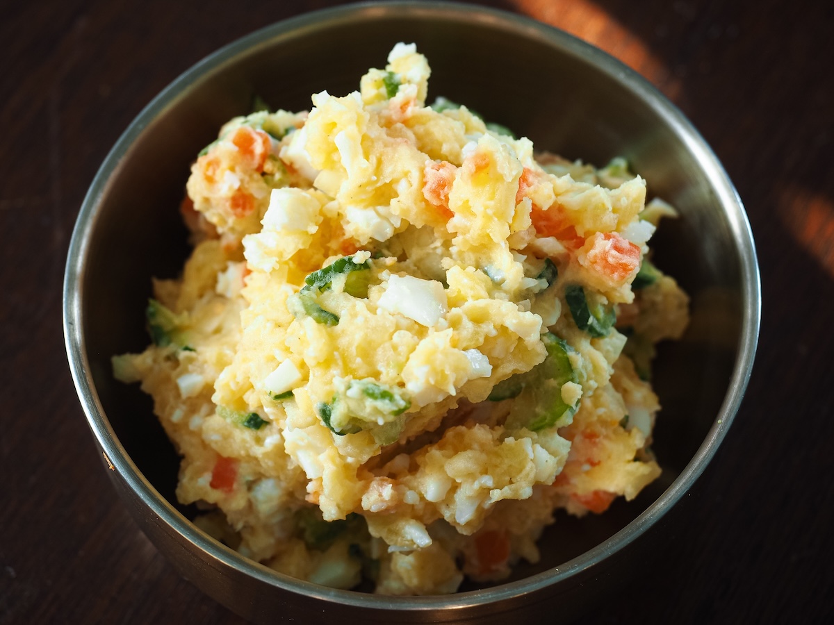 spring potato salad in a metal bowl