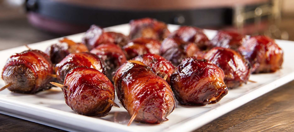 Smoked bacon wrapped meatballs, a.k.a. MOINK balls, on a white platter