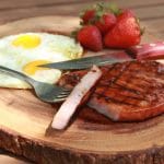 Grilled glazed ham steak plated