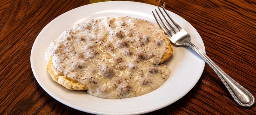 biscuits and sausage gravy on plate