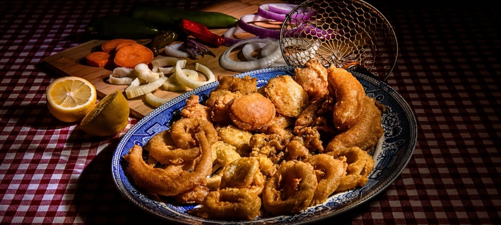 Platter filled with tempura battered fried vegetables