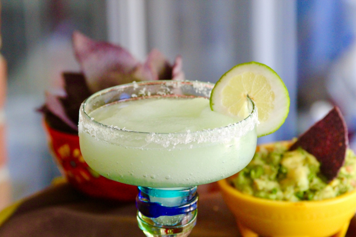 Grilled lime margarita in salt rimmed glass