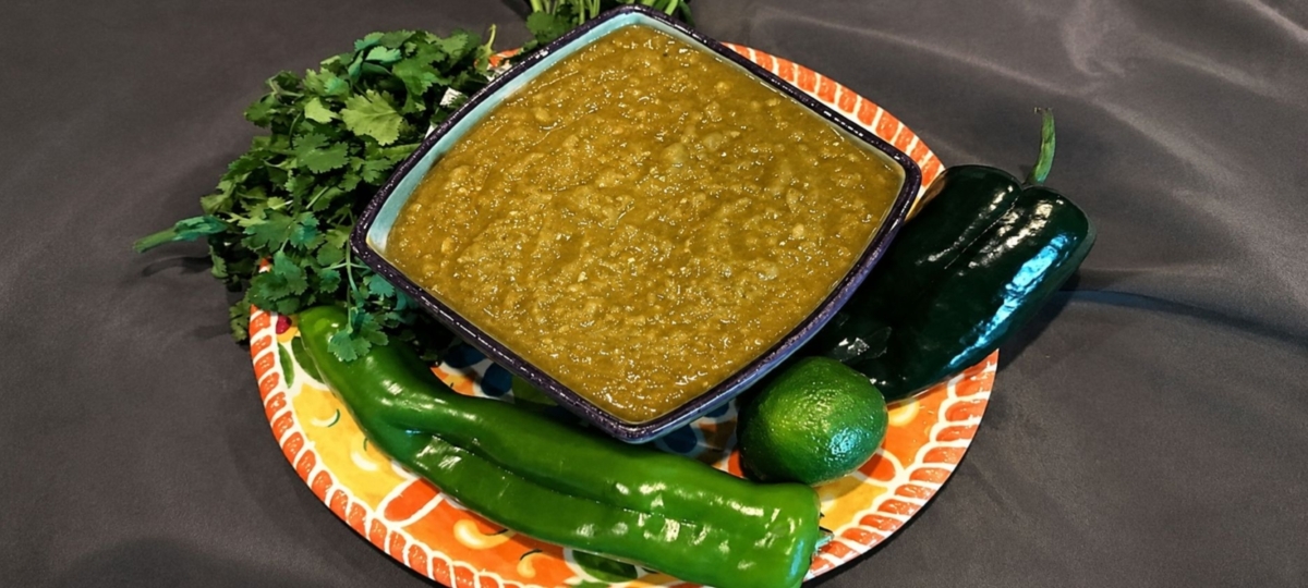 Salsa verde in a bowl surrounded by ingredients
