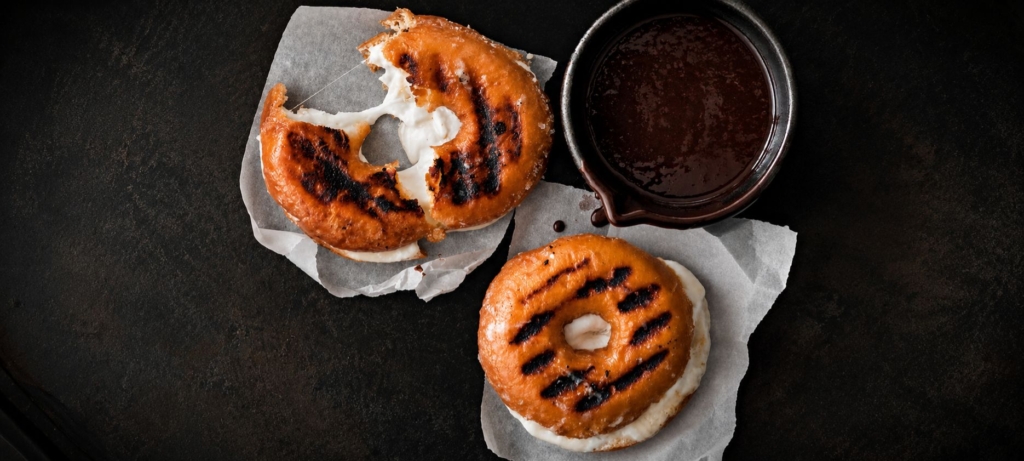 Grilled marshmallow filled donuts with chocolate sauce
