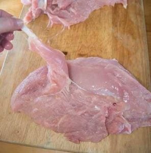 Removing the bones from the turkey breast