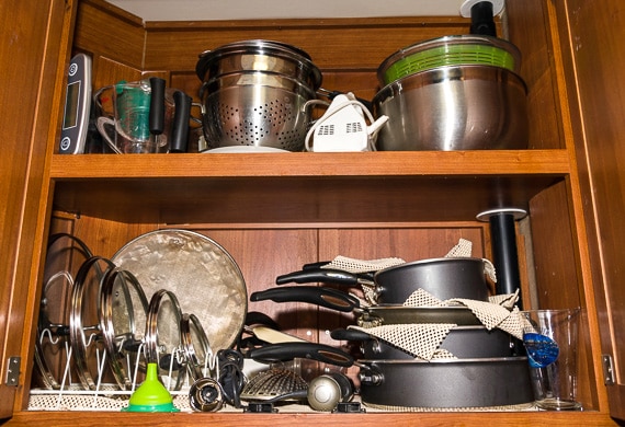 nesting pots and pan in cabinet