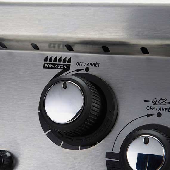 Control knobs on an outdoor gas grill.