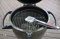 Pictures of a large oval shaped kamado with lid up and smaller round kamado with lid up.