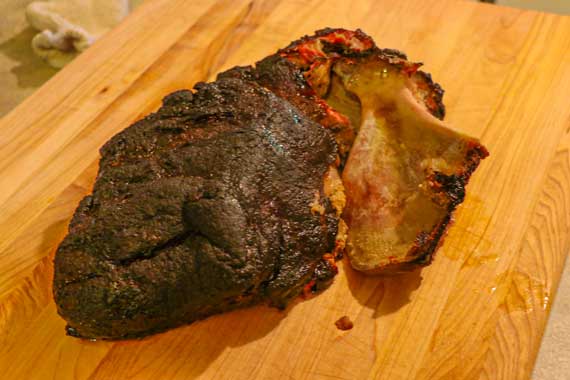 Piece of smoked meat falling off a bone.