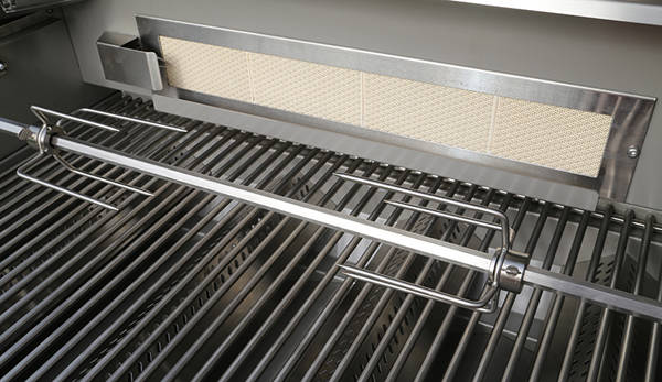Shiny stainless steel gas grill with lid up showing a rotisserie spit.