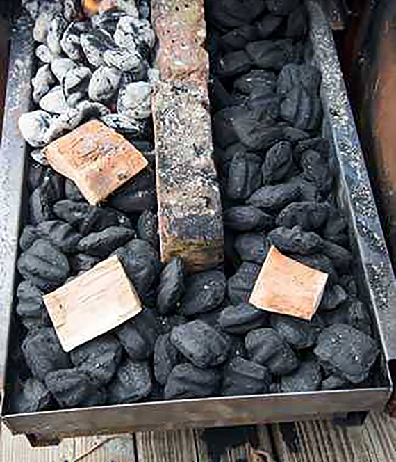 Charcoal in a charcoal tray set for smoking