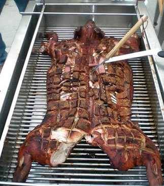 Whole animal on a smoker rack