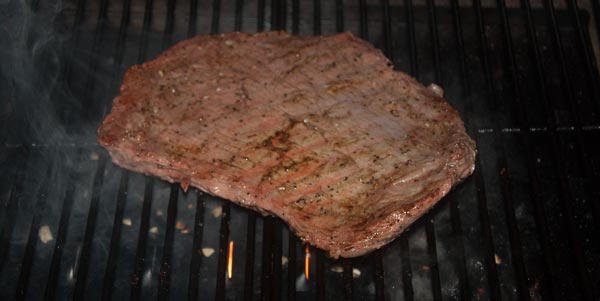 A steak cooking on a grill steak searing test
