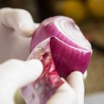peeling red onion