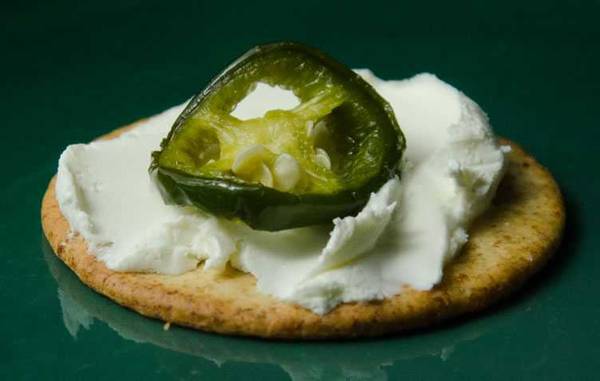 pickled jalapeno on a cracker