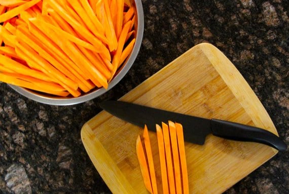 cutting sweet potatoes into fries