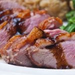 Sliced duck breast with cherry port sauce