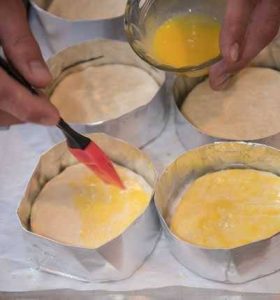 Brushing bread with an egg wash