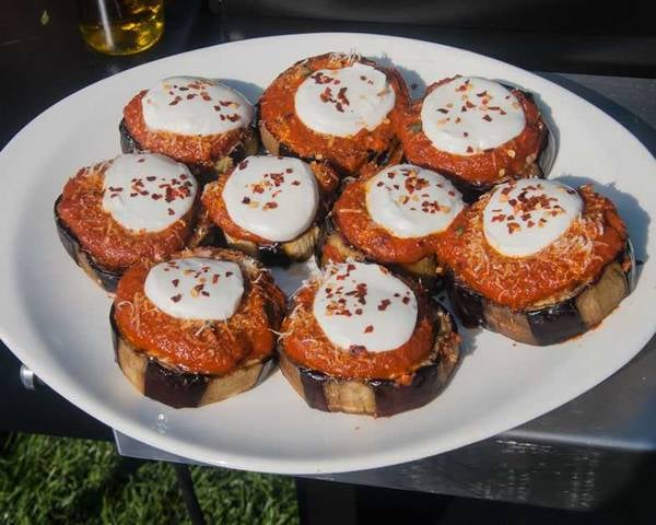Discs of eggplant topped with tomato sauce and mozarella