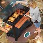 woman at grill standing on grill pad