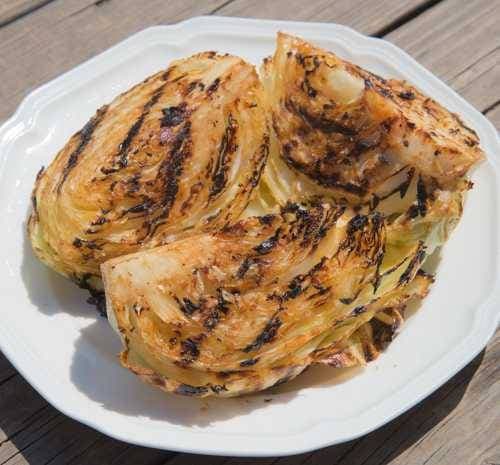 Grill marks stripe the sides of cabbage wedges