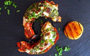 Halved grilled lobster tail