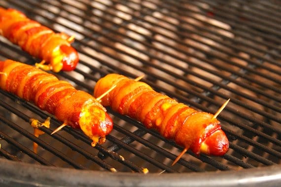 Grilling cheese stuffed bacon wrapped hot dogs